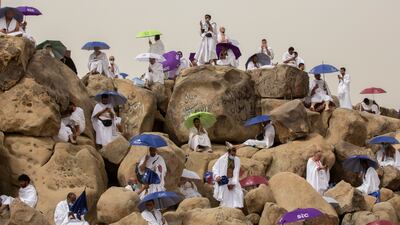 Pilgrims pray on top of the rocky hill known as the Mountain of Mercy, on the Plain of Arafat, near Makkah.