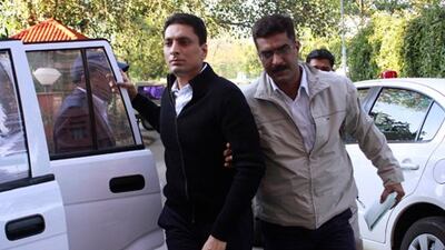 India's Central Bureau of Investigation (CBI) officials escort Shahid Balwa (C, in black) at the CBI headquarters in New Delhi. Reuters