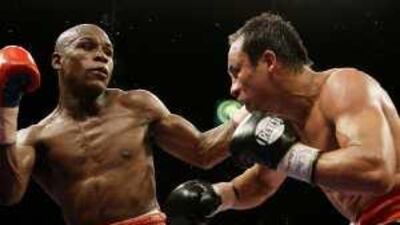 Floyd Mayweather Jr, left, connects with Juan Manual Marquez, of mexico, during their non-title welterweight bout on Saturday night.