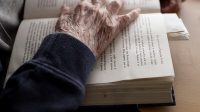 A resident reads a Spanish translation of the popular book 'The Adventures of Sherlock Holmes' by Sir Arthur Conan Doyle in a common area of the Casablanca retirement home in Villaverde, Madrid, Spain. EPA