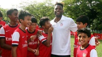 Alex Song, third right, at an Arsenal skills clinic for young footballers at a hotel in Selangor, outside Kuala Lumpur.