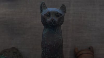 The small statues on display included deities such as Isis, Osiris and Bastet — the "protector" of the area in the form of a cat. Mahmoud Nasr / The National