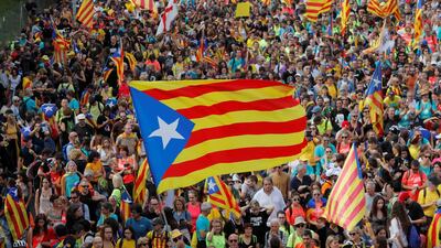 Catalan demonstrators wave Esteladas (Catalan separatist flags) as they block roads during Catalonia's general strike in Sant Just Desvern, Spain, October 18, 2019. REUTERS/Juan Medina