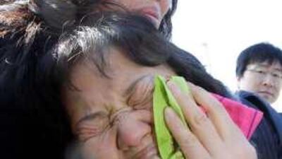 A woman mourns as the bodies of sailors from the Cheonan are returned to South Korea in late March.