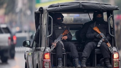 Security personnel escort a convoy of Pakistan and Sri Lanka cricketers to the Pindi Cricket Stadium before the start of play. AFP