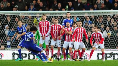 Chelsea player Gary Cahill pops up in the Stoke defensive wall as Willian prepares to take the kick during the Barclays Premier League match between Stoke City and Chelsea at Britannia Stadium on December 22, 2014 in Stoke on Trent, England. (Photo by Stu Forster/Getty Images)