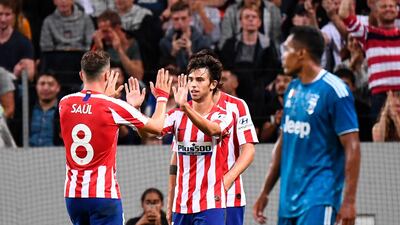 Joao Felix celebrates the first of his two goals against Juventus. AFP
