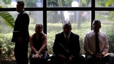 Job applicants wait for the opening of a jobs fair held by National Career Fairs in Florida. Lynne Sladky / AP Photo