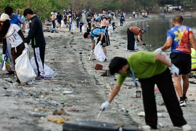 Volunteers in Manila, Philippines, partake in an Earth Day beach clean-up as the 2026 theme encourages people to take action. EPA