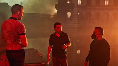 Chris Evans as Lloyd Hansen with 'The Gray Man' directors Anthony and Joe Russo.