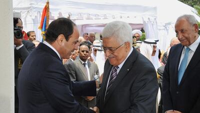 At his inauguration ceremony, Mr El Sisi, left, received Palestinian president Mahmoud Abbas. Mena news agency/AP Photo