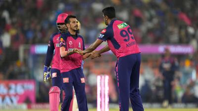 Rajasthan Royals' Ravichandran Ashwin, right, celebrates with teammate Yuzvendra Chahal after the dismissal of Royal Challengers Bengaluru's Cameron Green. AP