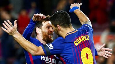 Lionel Messi, left, and Luis Suarez, right, will be key players for Barcelona against Real Madrid on Saturday. Quique Garcia / EPA