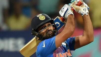 India’s Rohit Sharma plays a shot during the World T20 cricket tournament semi-final match between India and West Indies at The Wankhede Cricket Stadium in Mumbai on March 31, 2016. / AFP / PUNIT PARANJPE