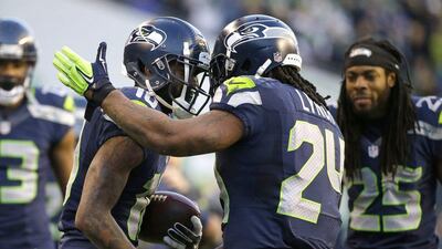 Seattle Seahawks wide receiver Paul Richardson, left, is congratulated after a touchdown on Sunday in their NFL win over the 49ers. Elaine Thompson / AP / December 14, 2014