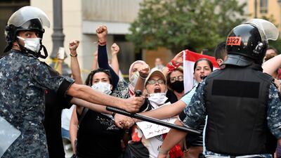 Anti-government protesters shout slogans during a protest against former Prime Minister Saad Hariri in downtown Beirut. EPA
