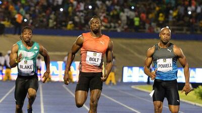 Usain Bolt, centre, wins the 100 metre final ahead of Yohan Blake, left and Asafa Powell in the Racers Grand Prix track and field event at the National Stadium in Kingston, Jamaica, Saturday, June 11, 2016. Collin Reid / AP Photo