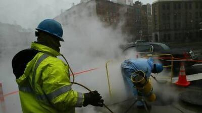 Workers with the Con Edison utility company open a manhole to the underground steam tunnels under the streets of New York. Data analysis helped Con Edison discover why manhole covers were exploding. Chris Hondros/Getty Images)