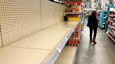 Shelves in the toilet paper aisle at a Walgreens store sit empty in Buffalo Grove, Illinois. AP Photo