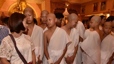 The boys and their coach gather at the Phra That Doi Wao Buddhist temple. AFP