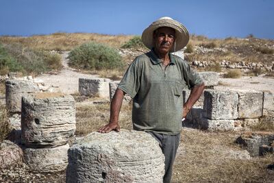 Moktasser Mahlouf, who looks after the Acholla archaeological site, near the coastal city of Sfax, poses for a picture on July 27, 2017. The ruins have never been open to the public and are poorly preserved. Sebastian Castelier for The National
