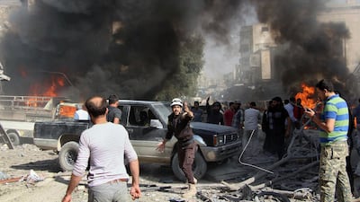 White Helmets rescue workers workers and Syrian citizens gathering after an airstrike on a market in Maaret Al Numan, southern Idlib / Syrian Civil Defence White Helmets via AP