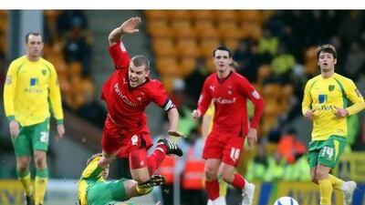 Stephen Dawson is challenged by Norwich City's David Fox during an earlier FA Cup round. The midfielder estimates as many as 70 of his family and friends will be at Brisbane Road today to see his side face Arsenal. Chris Radburn / PA