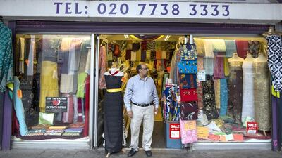Mohammed Shafiq stands outside his textiles shop. Mr Shafiq has been the proprietor of the business at Brixton arches for 10 years. Dan Kitwood / Getty