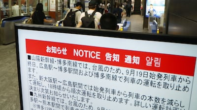 A sign at Hakata station notifies commuters of the suspension of train services. AFP