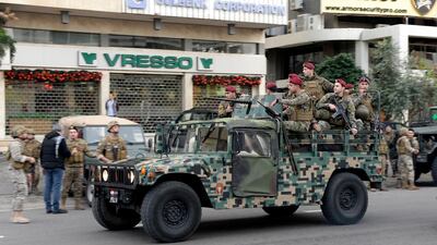 Lebanese army soldiers intervene as anti-government protesters (not pictured) attempt to blocks the highway during a protest at the Jal El Dib area north of Beirut, Lebanon. EPA