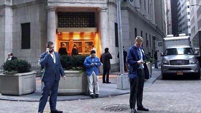 Trading at the New York Stock Exchange was to resume yesterday after being halted for two days because of the storm. Brendan McDermid / Reuters