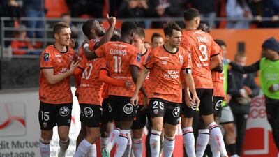 Lorient's Nigerian forward Terem Moffi, second left, celebrates with teammates after levelling at 1-1. AFP