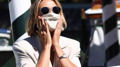 Italian actress Anna Foglietta wears a face mask as she arrives at Lido Beach ahead of the 77th annual Venice International Film Festival, on September 1, 2020. Foglietta will host the opening and closing ceremony of the festival. EPA