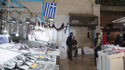 Fishmongers wait for customers during a new lockdown in Athens, Greece. Bloomberg