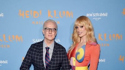 Fashion designer Jeremy Scott and Gigi Goode. Invision / AP