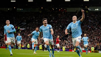 Manchester City's Erling Haaland, right, celebrates after scoring his side's opening goal. AP