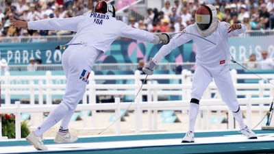 France's Valentin Prades competes with Egypt's Ahmed Elgendy, right, in the men's individual fencing. AFP