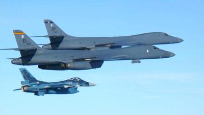 US Air Force B1-B bombers fly with a Japan Air Self Defence Force F-2 fighter during exercises over the island of Kyushu, just south of the Korean peninsula, on July 30, 2107. Japan Air Self Defence Force via AP
