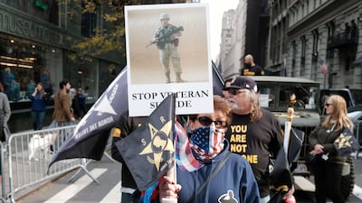 Families of soldiers who died by suicide march during the Veterans Day Parade in New York in November 2021. Getty / AFP