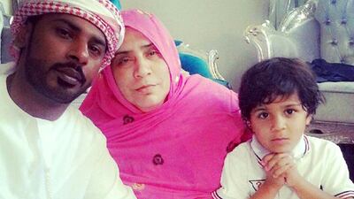 Juma with his mother Nasem Al Bashier and son Mohammed. He had wanted to earn enough money to buy his children school uniforms. Reem Mohammed / The National