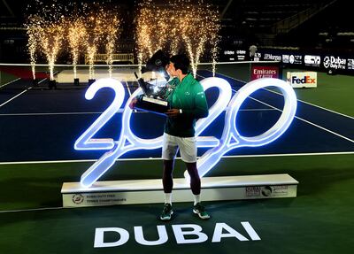 Novak Djokovic celebrates with the trophy after winning the Dubai Duty Free Tennis Championships. Getty Images