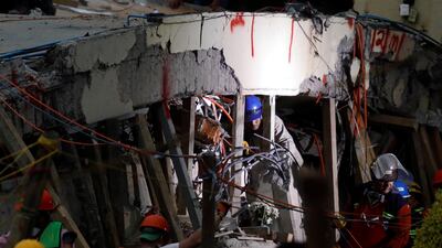 Rescue workers search through the rubble for students at Enrique Rebsamen school after an earthquake in Mexico City. Edgard Garrido / Reuters