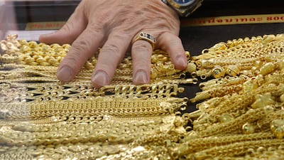 Gold prices have fallen more than 14 per cent in the past month. EPA