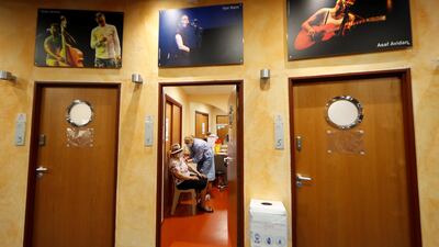A senior citizen receives a coronavirus vaccine at the Theatre de Verdure in Nice, France, which has been transformed into a vaccination centre. Reuters