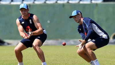 England's captain Joe Root, right, and Jos Buttler take part in catching practice at the Sinhalese Sports Club in Colombo ahead of the third Test. AFP