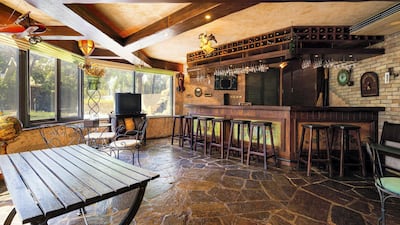 The stone tavern located in the garden.