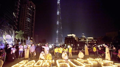 UAE community action for Earth Hour 2013, at the Burj Plaza, Dubai, but too many people think of climate change as a distant problem, say environmental communications experts. Jaime Puebla / The National