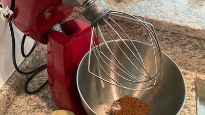 Step 1: Add equal part instant coffee, sugar and hot water to a mixing bowl.