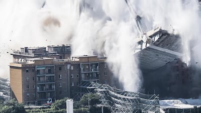 The demolition of the large towers '10' and '11' of the Morandi bridge using micro-explosive charges, in Genoa, northern Italy. EPA