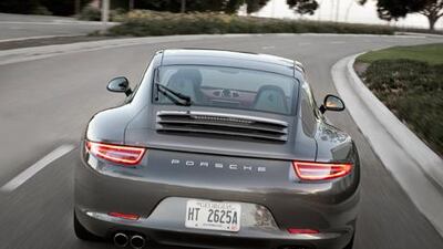 Though it’s longer, wider and lighter than the previous generation, the new Porsche 911 retains the car’s unmistakable profile and boxer-six engine layout. Courtesy of Porsche